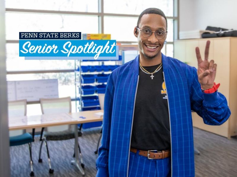 Brandon Everett holds up a peace sign with text reading "Penn State Berks Senior Spotlight" appearing over image