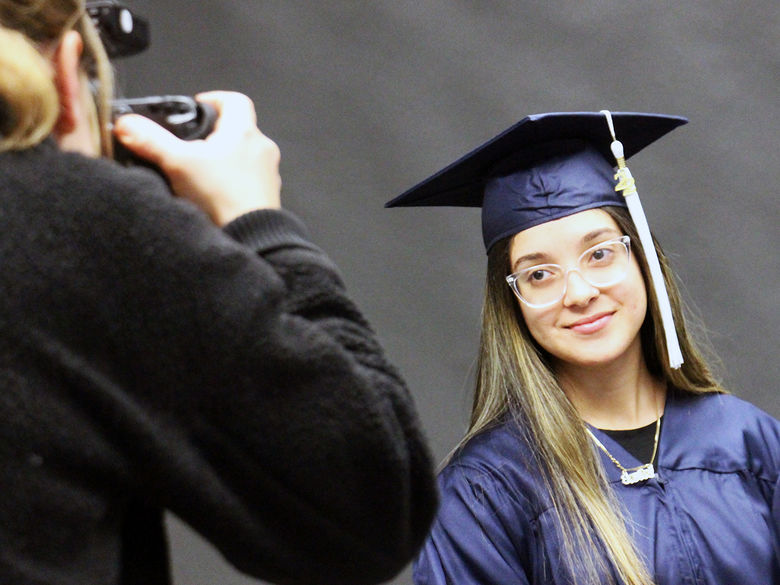 Senior getting their picture taken during Salute to Seniors Day