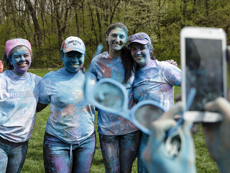 Students pose for picture after running the ROY G BIV Memorial Run