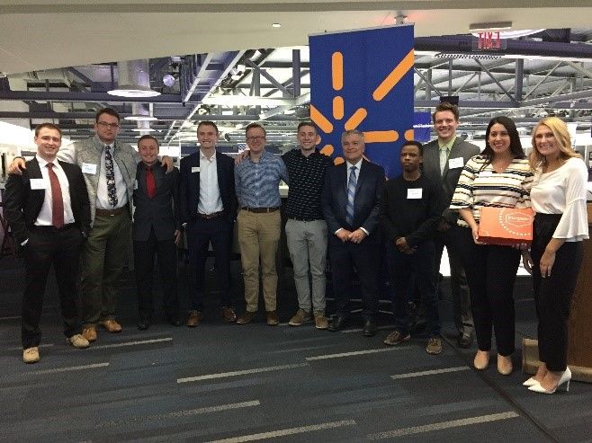 President Baron get a photo with students during the Invent Penn State initiative.