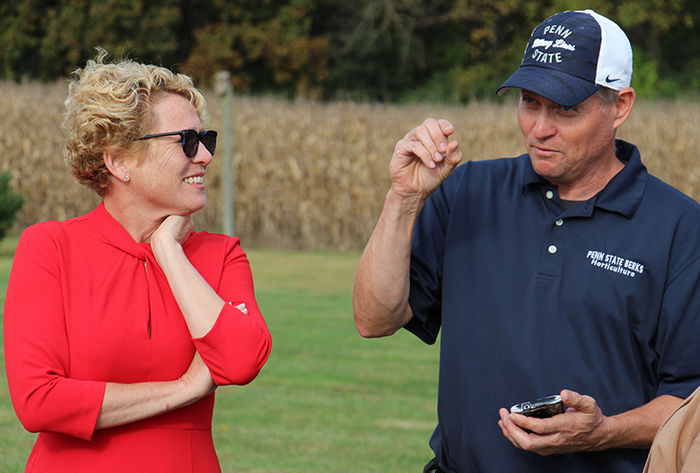 John Rost describes the lanternfly to Congresswoman Houlahan.