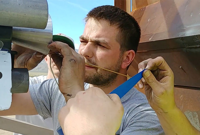 Kale Odhner makes the final adjustments to the rocket