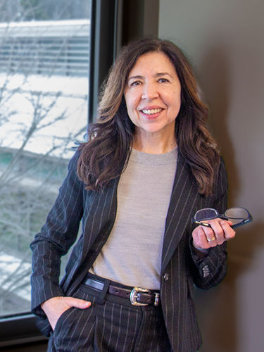 Belén Rodríguez Mourelo stands in an office in the Gaige Building.