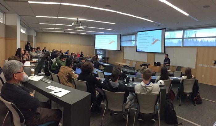 Sudents listen to a presentation in a classroom