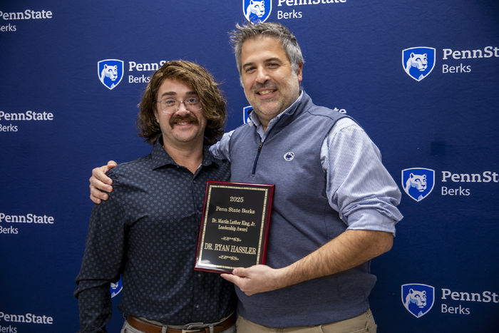 Ryan Hassler is pictured with his award