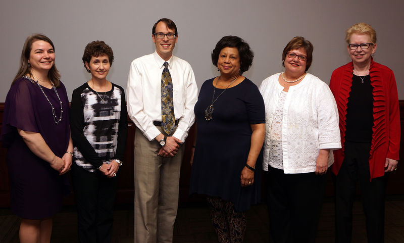 2017 Penn State University Libraries Award winners group of five women and one man standing in a row after being honored at a ceremony
