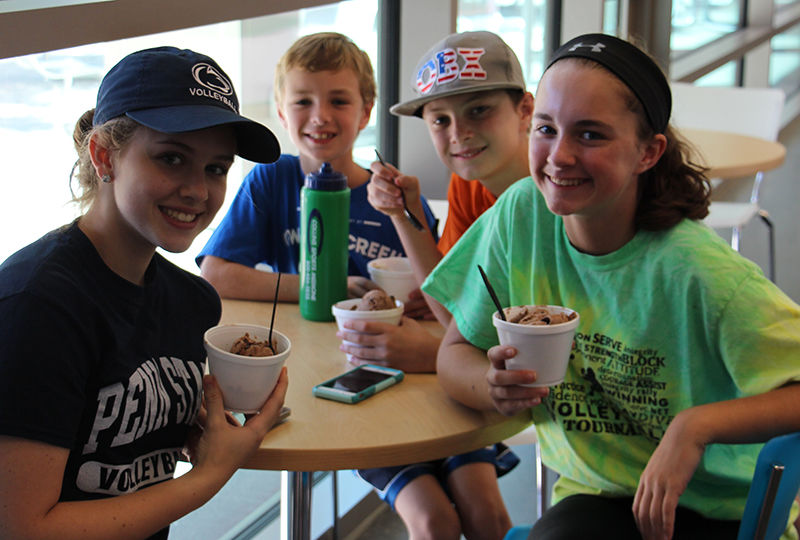 Kids enjoying Creamery ice cream at Homecoming