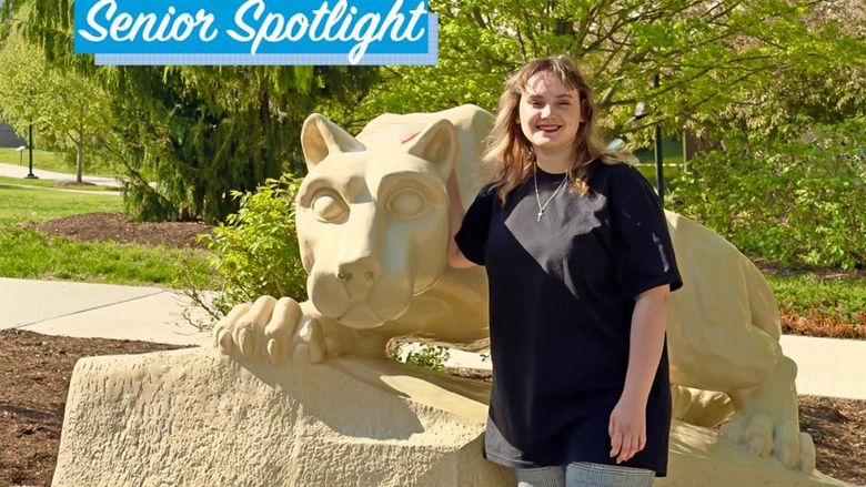 Viktoriia Vozharenko standing by Lion Shrine