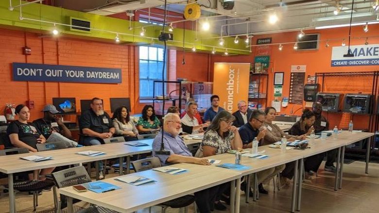 Attendees sit in Berk LaunchBox presentation
