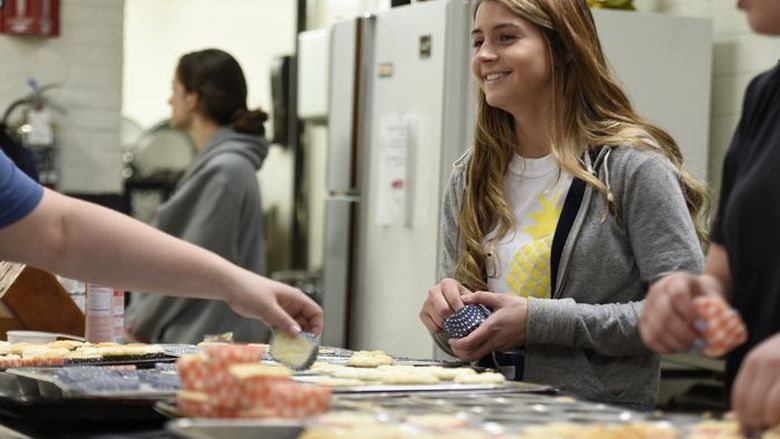 Penn State Berks students prepare and serve a multiple course meal for residents at the Opportunity House.