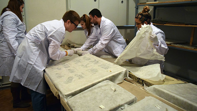 students preserving documents
