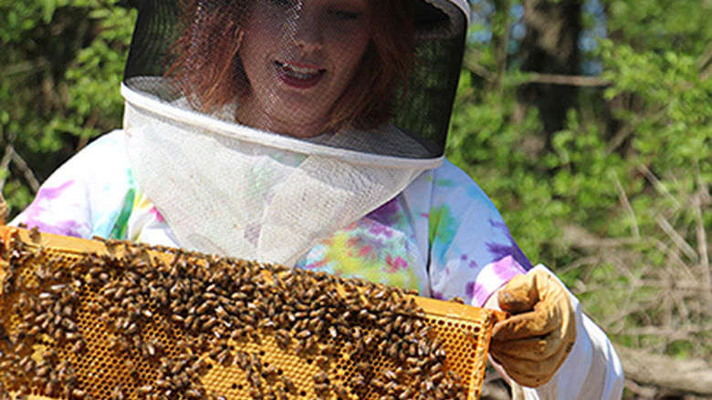 student with beehive