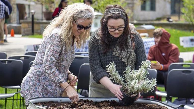 Staff and student at Earth Day event