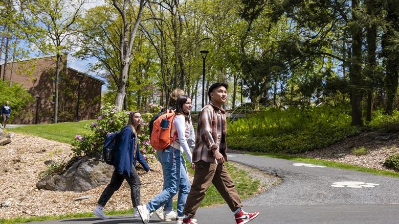 Students walking on campus on a sunny day