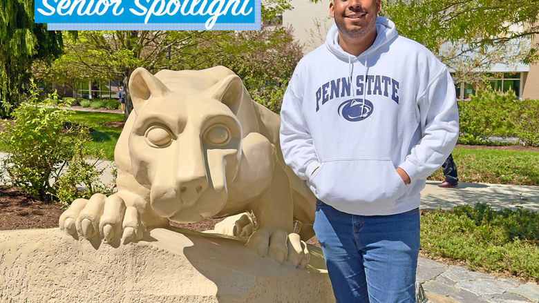 Christian Clarke standing by the lion shrine