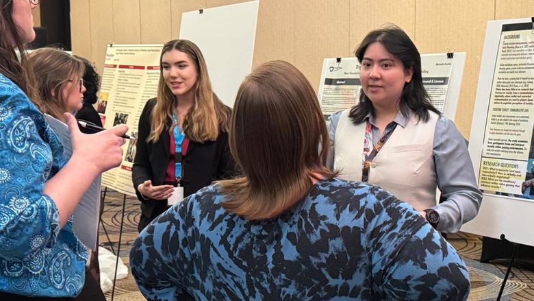 Berks students present their work at the conference.