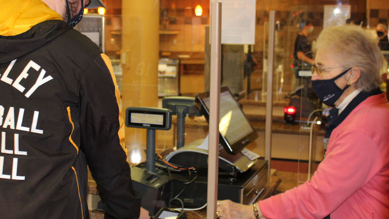 Port Sky cashier Theresa "Terry" Karcz helps a Penn State Altoona student "swipe out hunger" 