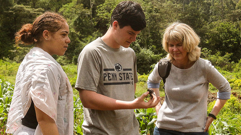 Janelle Larson helps plant trees.