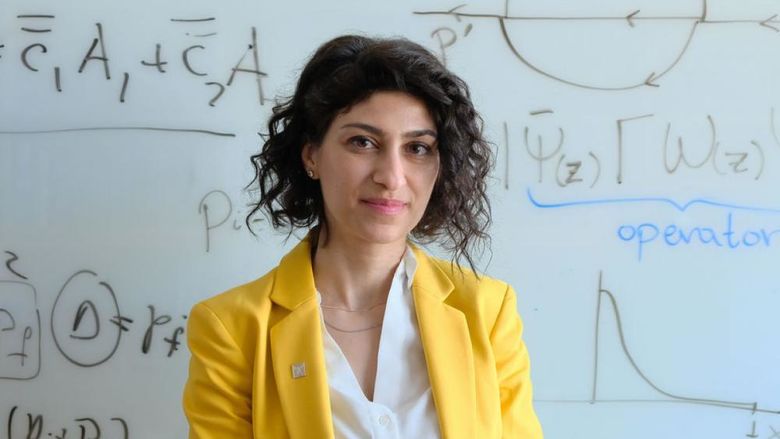 Martha Constantinou in front of equations