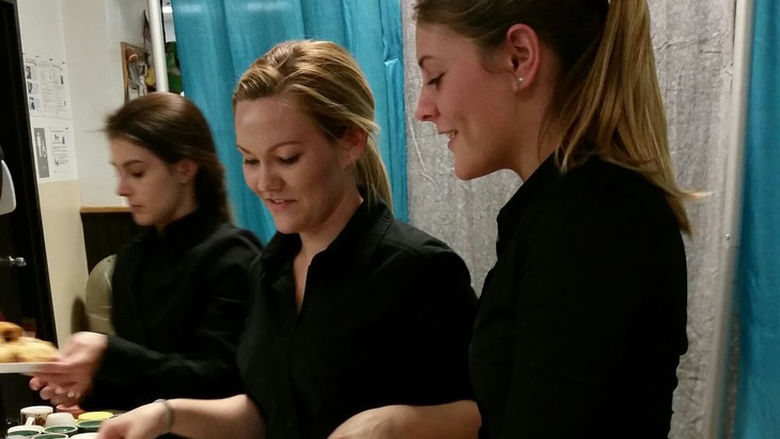 Penn State Berks students prepare and serve dinner to the clients of Opportunity House, in Reading, Pennsylvania.