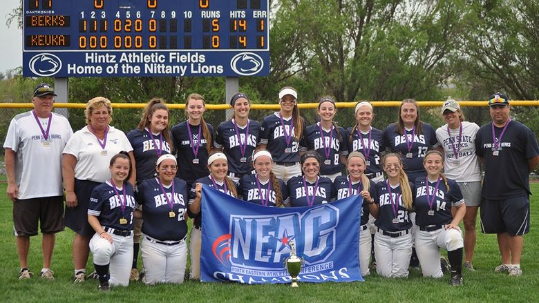 Berks Softball team with NEAC Championship flag