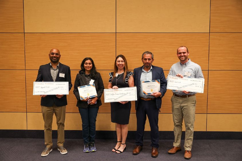 winners of idea testlab holding large checks
