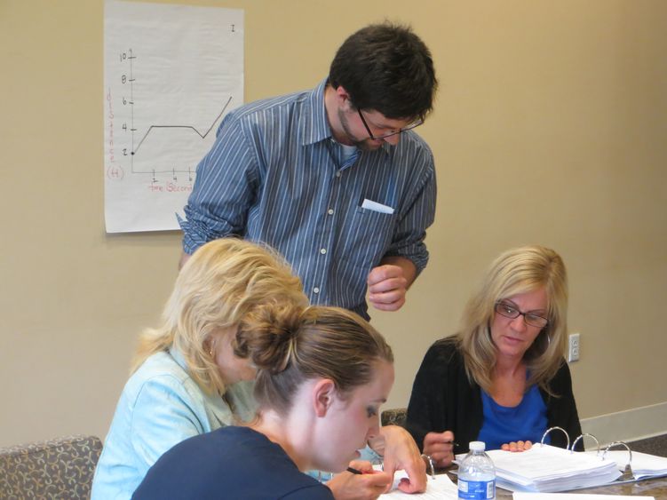 Andrew Baxter helping PMI participants