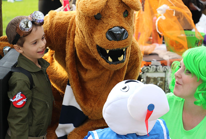 Trick-or-Treaters getting their photo taken with the lion at Fall Fest. Trick-or-Treaters getting their photo taken with the lion at Fall Fest.