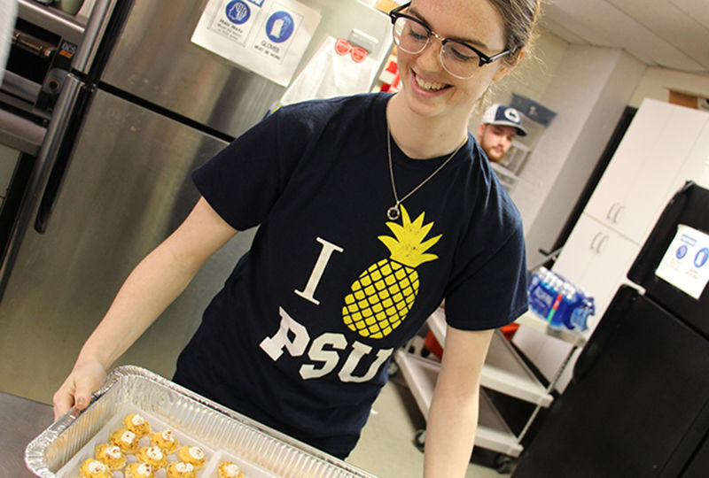 Student preparing food at Opportunity House Student preparing food at Opportunity House