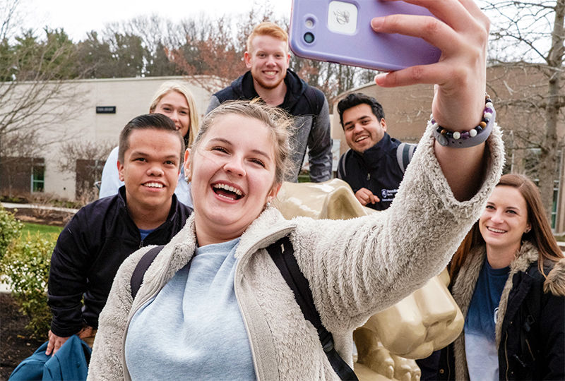 Students take a selfie around the lion shrine at Penn State Berks. Students take a selfie around the lion shrine at Penn State Berks.