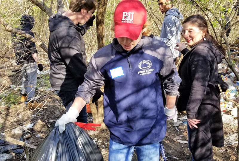 Students help cleanup park trails. Students help cleanup park trails.