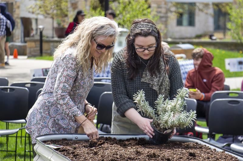 Staff and student at Earth Day event