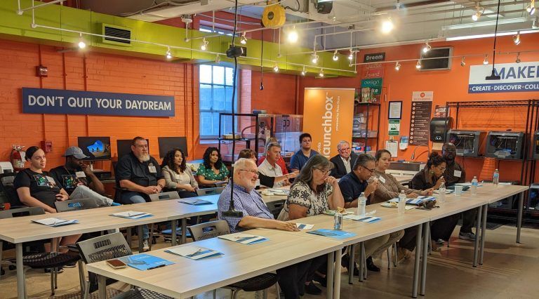 Attendees sit in Berk LaunchBox presentation