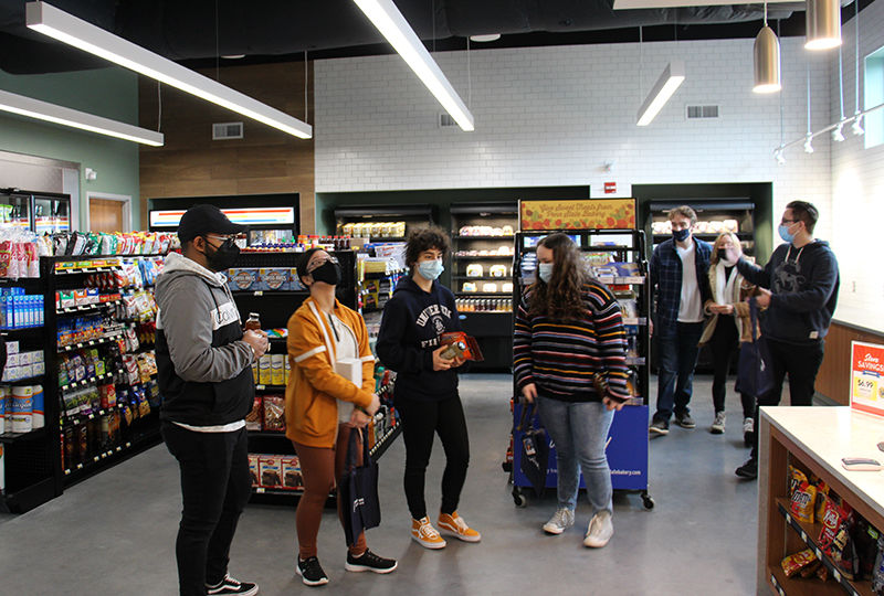 Student inside the newly open Creekside Market at Penn State Berks.