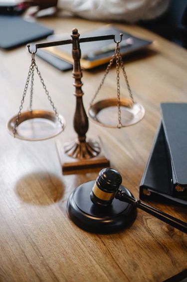 Justice scales, gavel, and books.