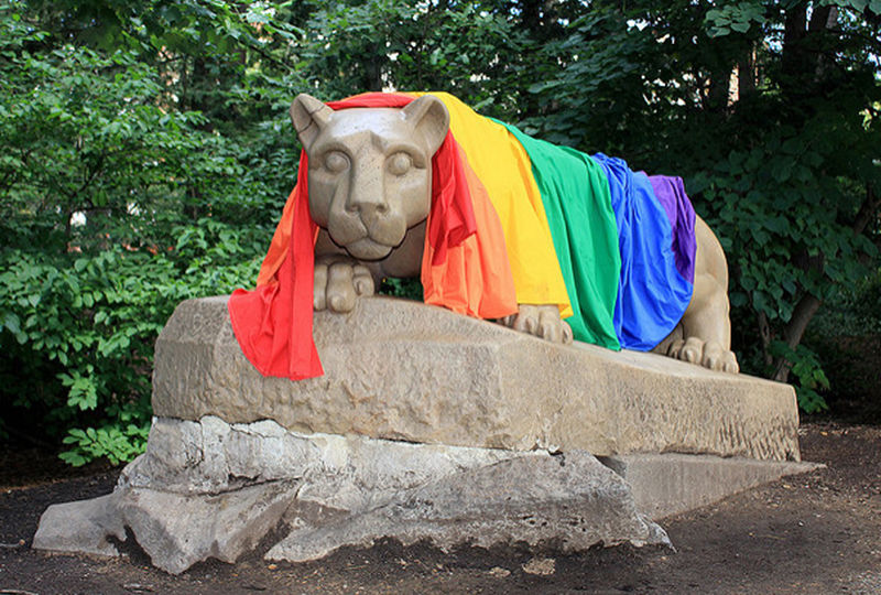 A rainbow pride flag over the Nittany Lion. A rainbow pride flag over the Nittany Lion.
