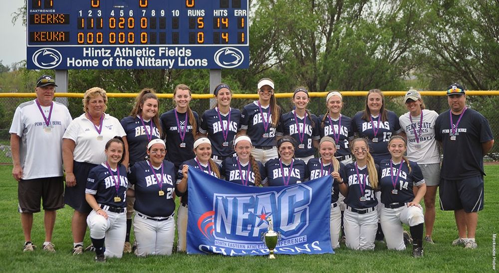 Berks Softball team with NEAC Championship flag