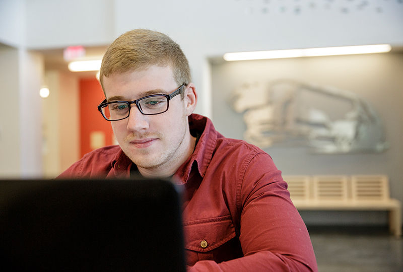 Berks student focusing on his studies in the library. Berks student focusing on his studies in the library.